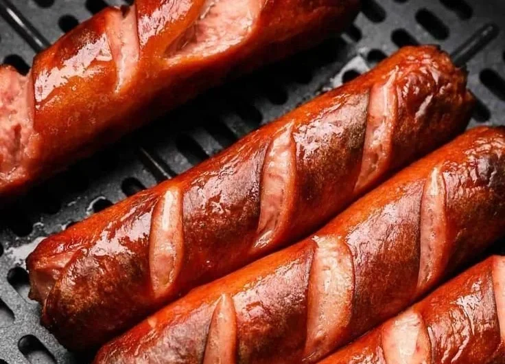 Easy air fryer hot dogs cooked to perfection with a crispy exterior and juicy inside