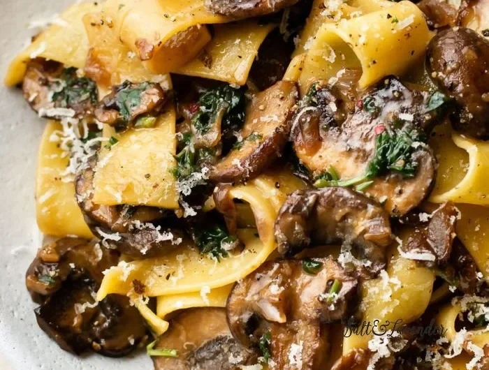 Delicious garlic mushroom pasta dish served in a bowl with herbs