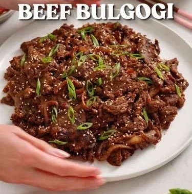 Delicious homemade Easy Korean Bulgogi served with rice and vegetables.