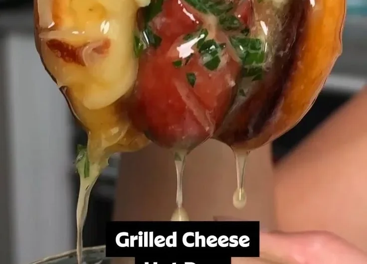 Delicious garlic butter grilled cheese hot dogs served on a plate.