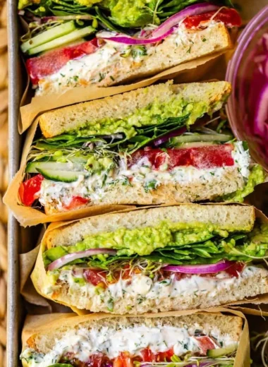 Laura's Amazing Fresh Veggie Sandwich with colorful vegetables and fresh ingredients