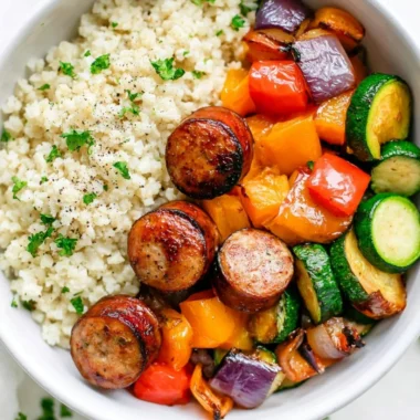 Plate of 10 minute air fryer chicken sausage and assorted vegetables