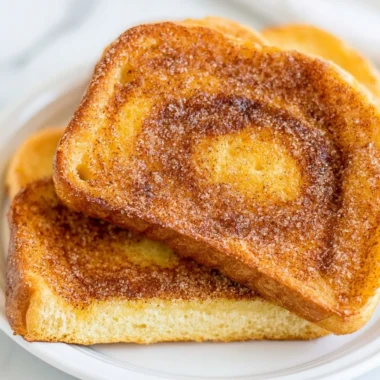 Delicious air fryer cinnamon toast, golden and crispy, topped with cinnamon sugar.