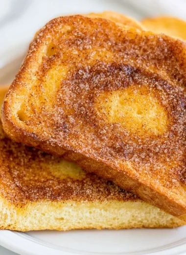 Delicious air fryer cinnamon toast, golden and crispy, topped with cinnamon sugar.