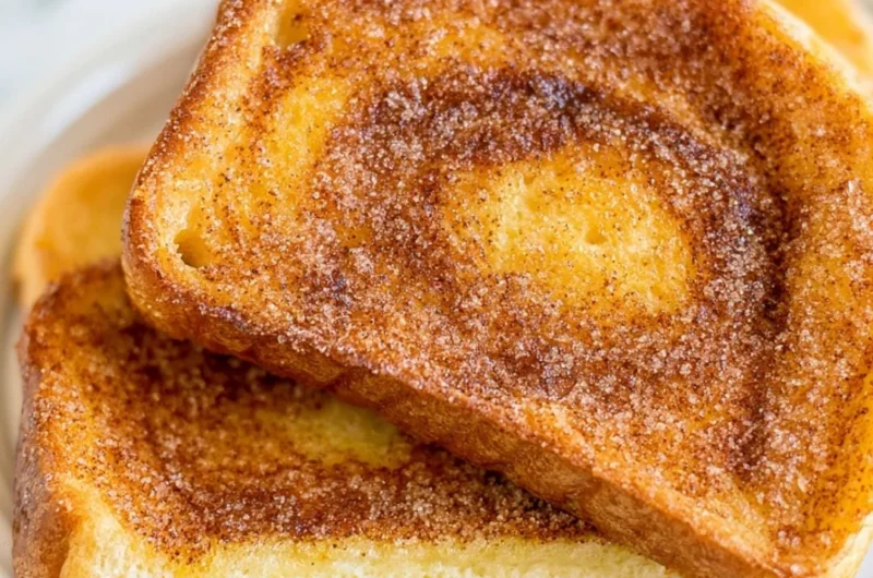 Delicious air fryer cinnamon toast, golden and crispy, topped with cinnamon sugar.