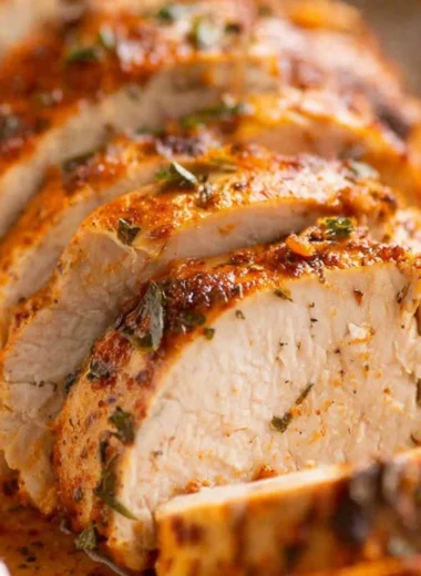 Juicy baked pork tenderloin served with herbs and spices