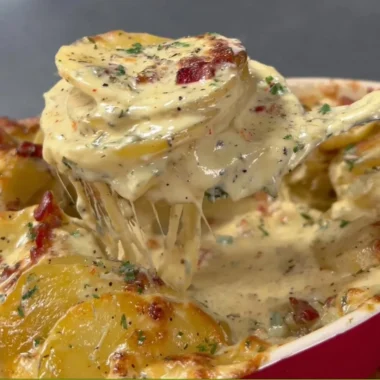Delicious Cheesy Au Gratin Potatoes baked to perfection, with a golden crispy top.