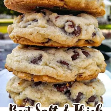 Freshly baked chocolate chip cookies on a cooling rack