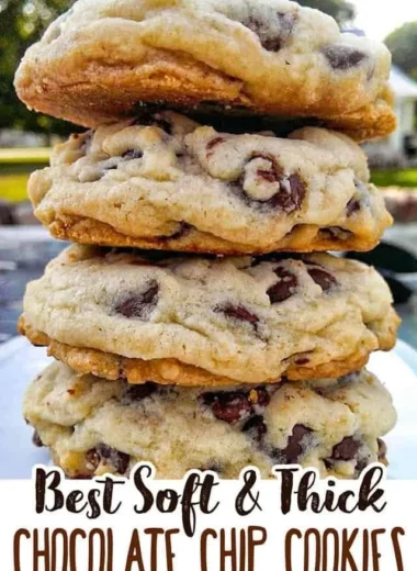 Freshly baked chocolate chip cookies on a cooling rack