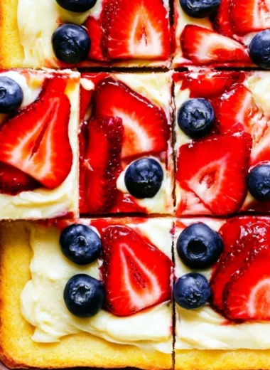 Delicious easy fruit pizza topped with fresh fruits and creamy frosting.