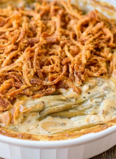 Delicious green bean casserole with crispy onion topping