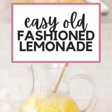 Pitcher of homemade lemonade with fresh lemons and mint leaves