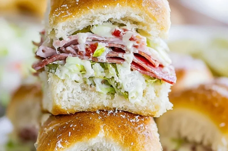 Italian Grinder Sliders stacked with fresh ingredients on a platter