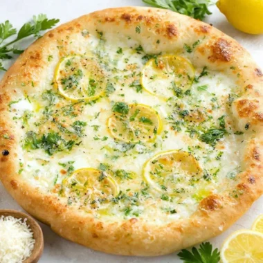 Delicious Lemon Pizza topped with fresh ingredients and citrus zest