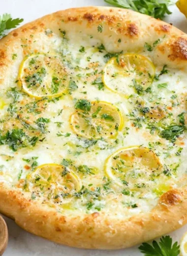 Delicious Lemon Pizza topped with fresh ingredients and citrus zest