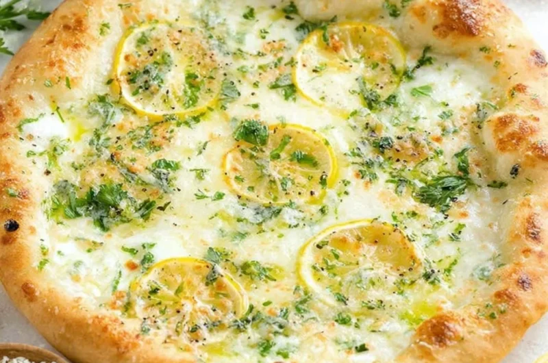 Delicious Lemon Pizza topped with fresh ingredients and citrus zest