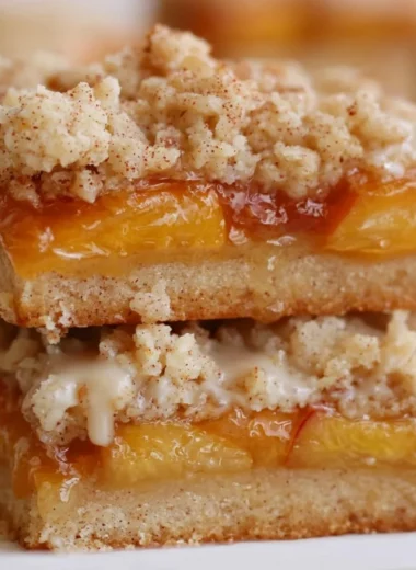 Delicious homemade peach bars with a golden crust and fresh peach filling