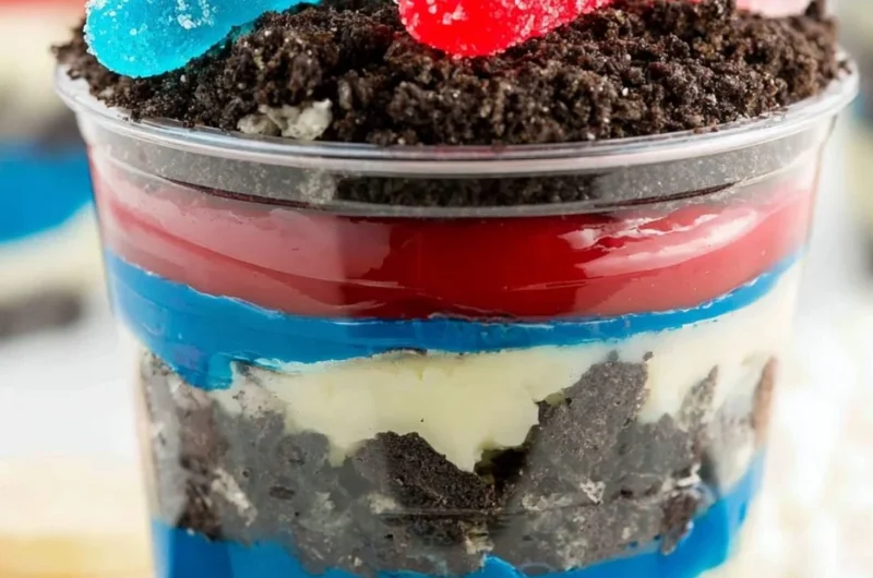 Red, White and Blue Dirt Cups dessert with layered colors and toppings