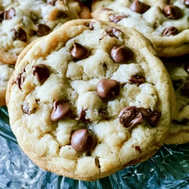 Freshly baked soft batch chocolate chip cookies on a cooling rack