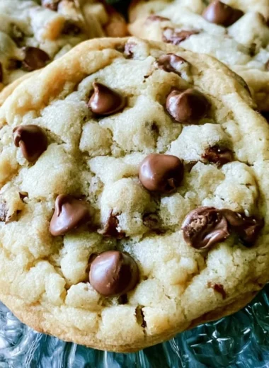 Freshly baked soft batch chocolate chip cookies on a cooling rack