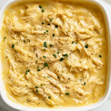 Delicious serving of chicken and gravy with mashed potatoes and vegetables