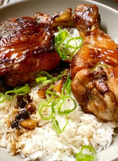 Delicious Chicken Adobo served in a cozy setting with rich flavors and spices.