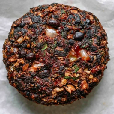 Cozy mushroom veggie burgers on a plate with fresh ingredients.
