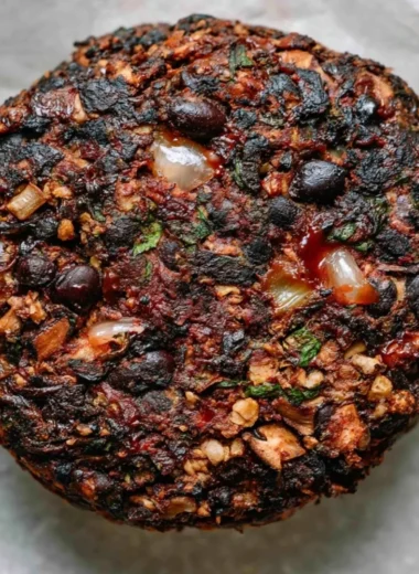 Cozy mushroom veggie burgers on a plate with fresh ingredients.