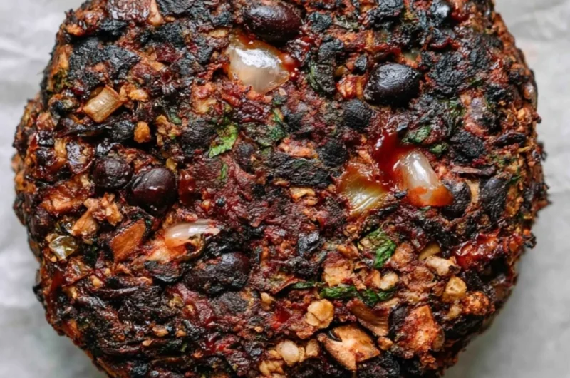 Cozy mushroom veggie burgers on a plate with fresh ingredients.