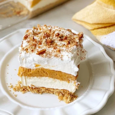 Delicious cozy pumpkin lush dessert with creamy layers and festive spices