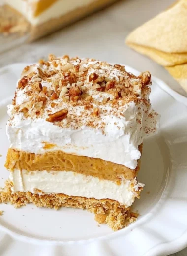 Delicious cozy pumpkin lush dessert with creamy layers and festive spices