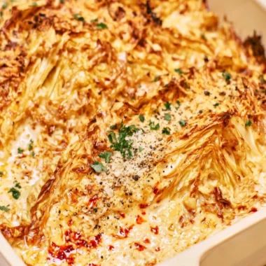 Creamy garlic butter cabbage dish served with fresh herbs