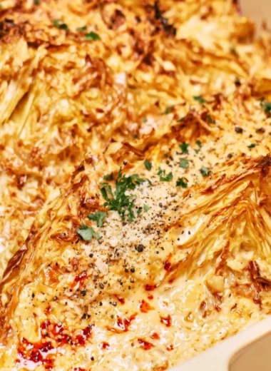Creamy garlic butter cabbage dish served with fresh herbs