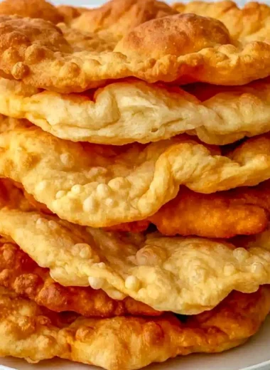 Homemade fry bread served with toppings on a rustic table