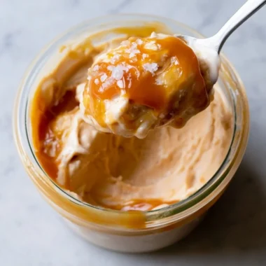 Ninja Creami Salted Caramel Protein Ice Cream in a bowl with a spoon.
