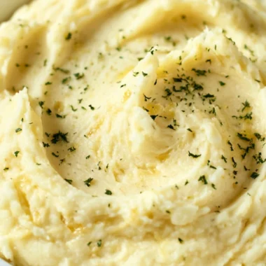 Cozy Garlic Mashed Potatoes Recipe served with butter and herbs