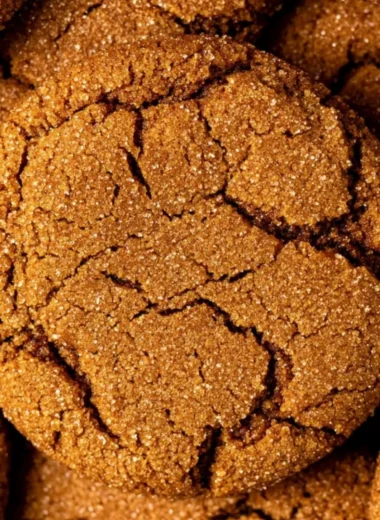 Cozy gingersnap cookies on a plate, topped with sugar and spices.